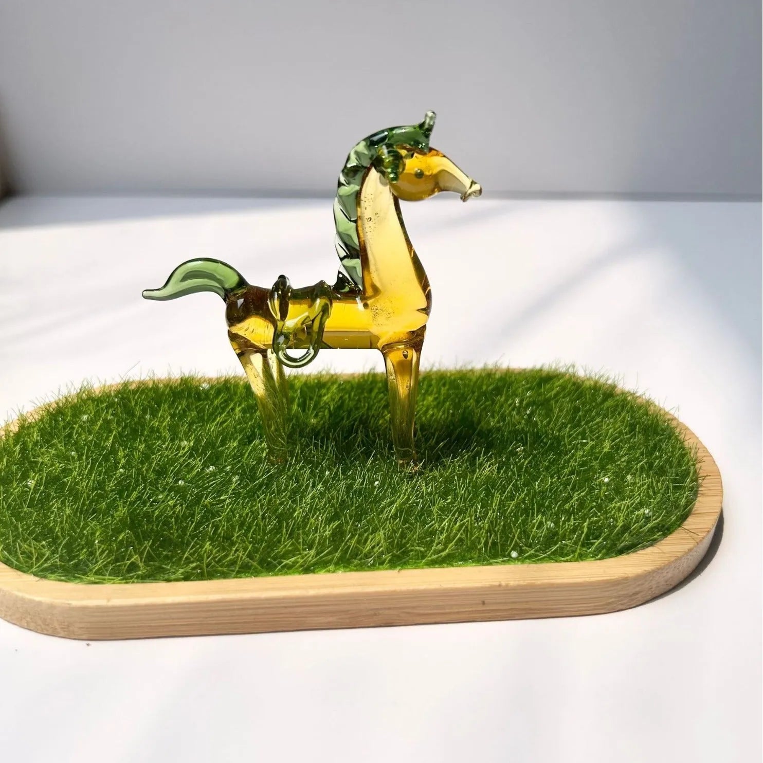 Brown coloured glaze horse decoration on wooden desk
