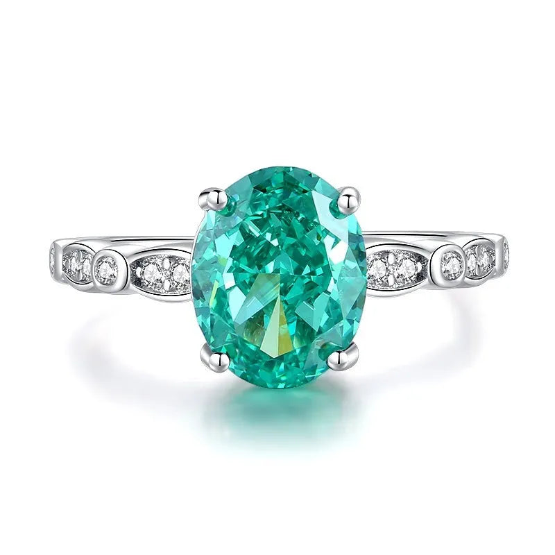 S925 silver emerald ring for women with inlaid high carbon diamonds in a geometric design on a white background.