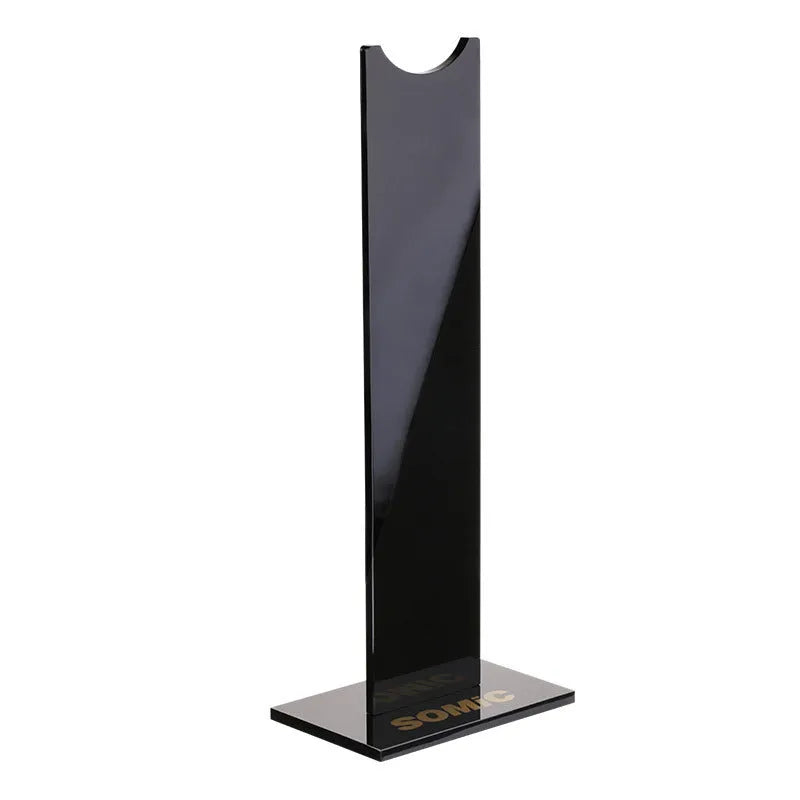 Pink and black detachable gaming headset stand on a desk with a non-slip silicone base.