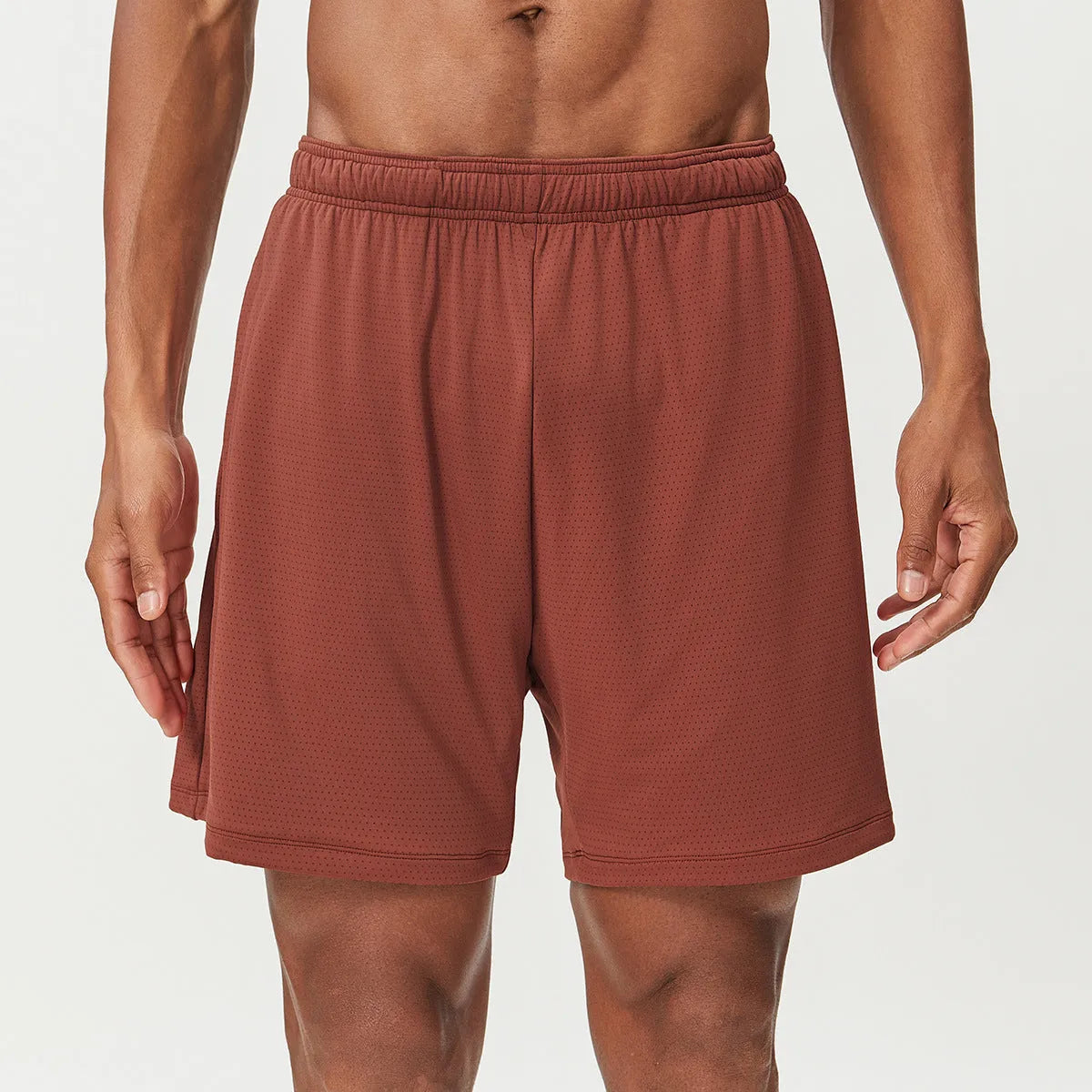 Men's double-layer running shorts in sky green, showing mid-waist fit and shorts length.