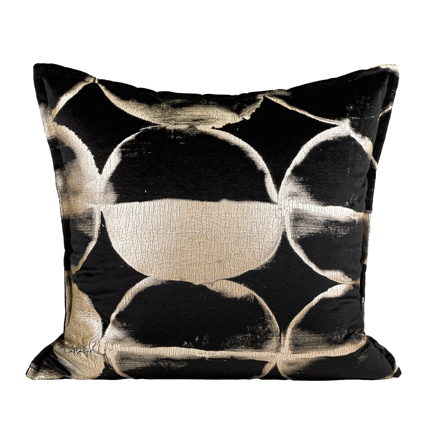 Black and gold abstract patterned flannel cushion on a sofa, showing removable cover.