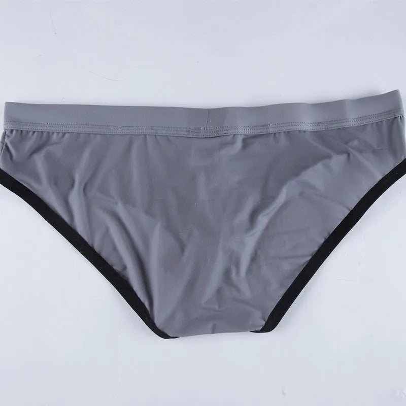 Men's mid-waist ice silk briefs in army green showing thin nylon fabric and bullet separation pouch design.