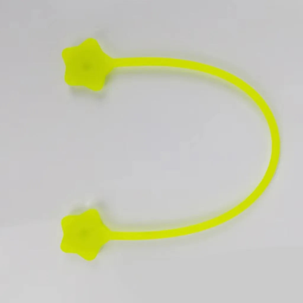 Purple silicone star-shaped magnet winder for clipping onto and organising headphone or phone charging cables.