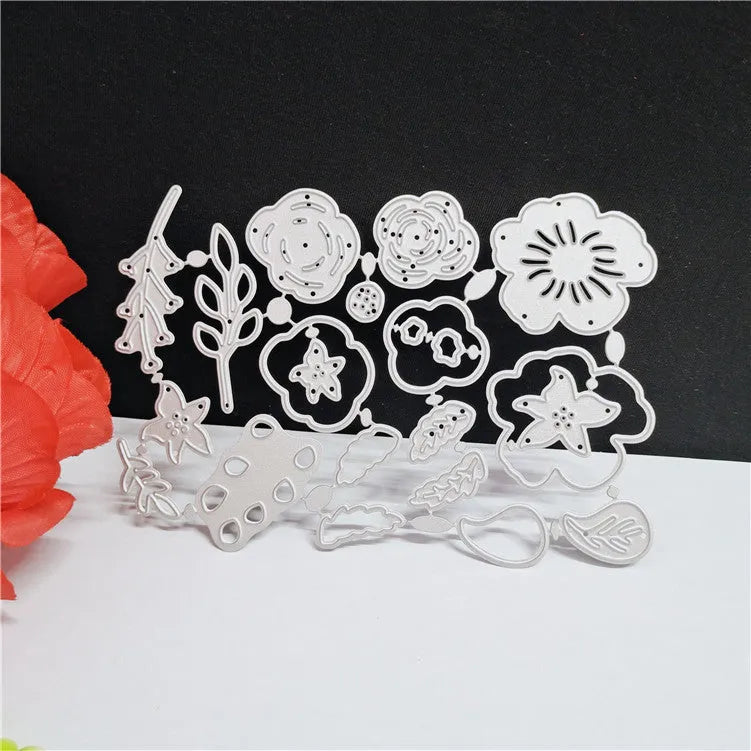 Silver carbon steel flower-shaped cutting mould measuring 14.3 by 9.9 centimetres
