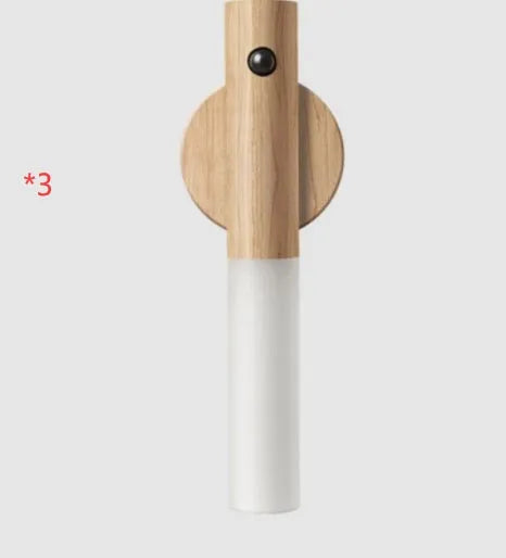Smart sensor LED desk lamp with solid wood base and clear acrylic shade on a wooden table.