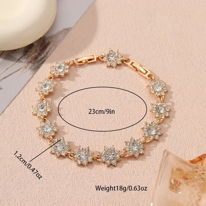 Gold and silver electroplated flower bracelet with coloured gemstone accents on zinc alloy