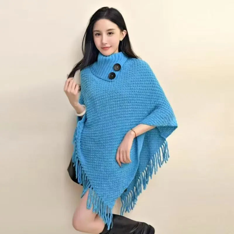 Women's plush cashmere blend triangle shawl cape with tassel trim in multiple colour options.