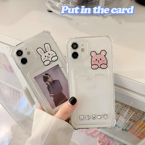 Transparent cartoon graphic iPhone back cover case with a slot for holding credit cards.