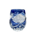Crystal glass Jianghu Cut Zi Xinglu tumbler in violet with carved pattern on a bar surface