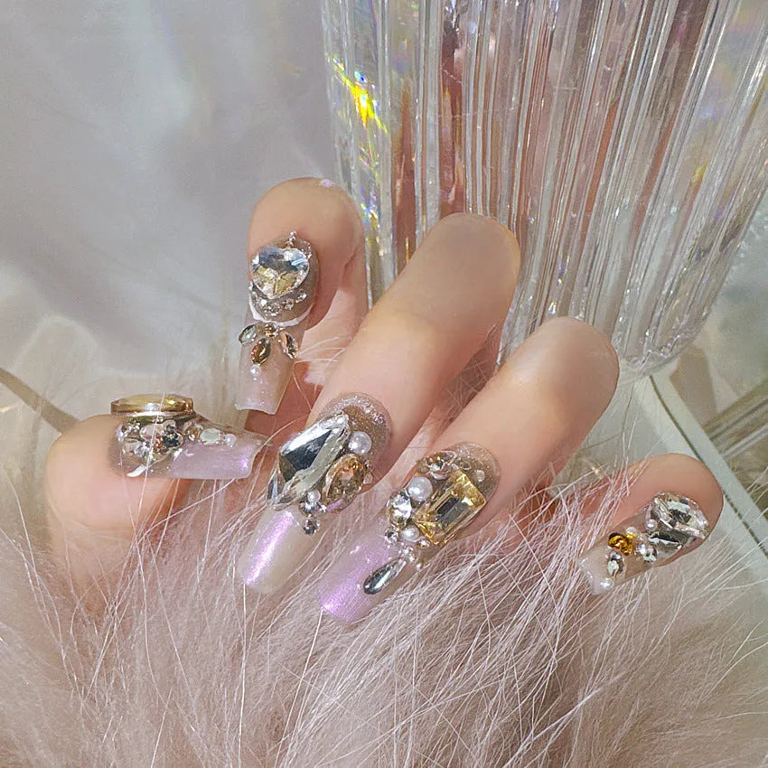 False nail patches with rhinestone decoration on card paper packaging with application tools