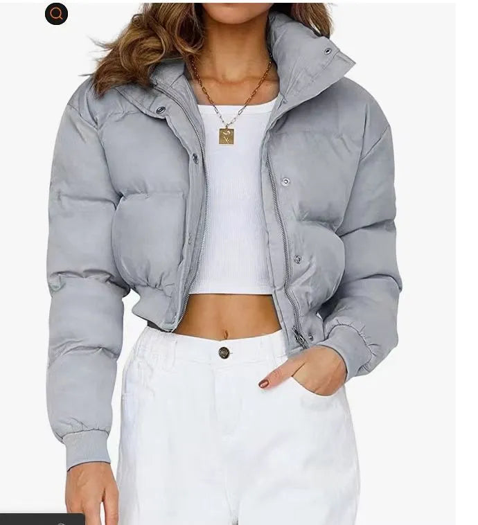 Women's loose blue polyester jacket with long sleeves shown front view