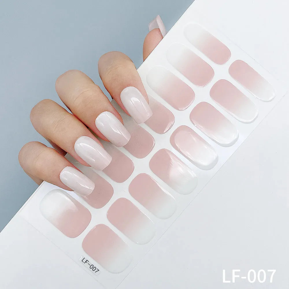 Set of 16 solid colour nail art stickers showing floral, geometric, and pattern designs for manicure application