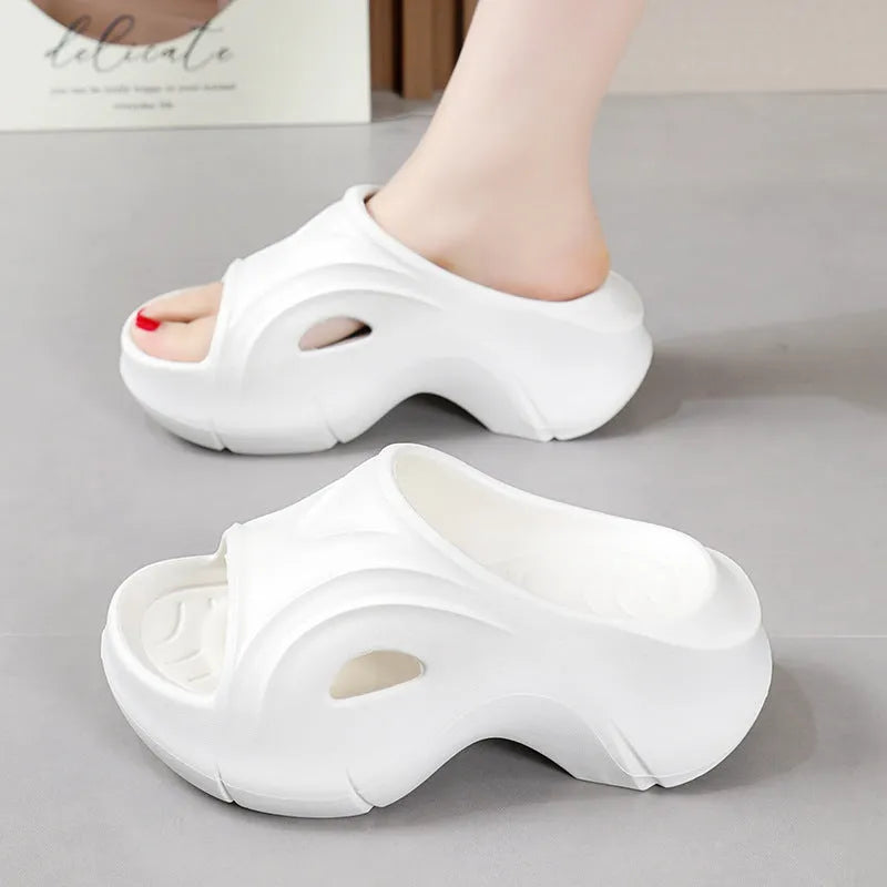 Women's thick-soled beach slippers in white, black, and rose red colours with EVA construction