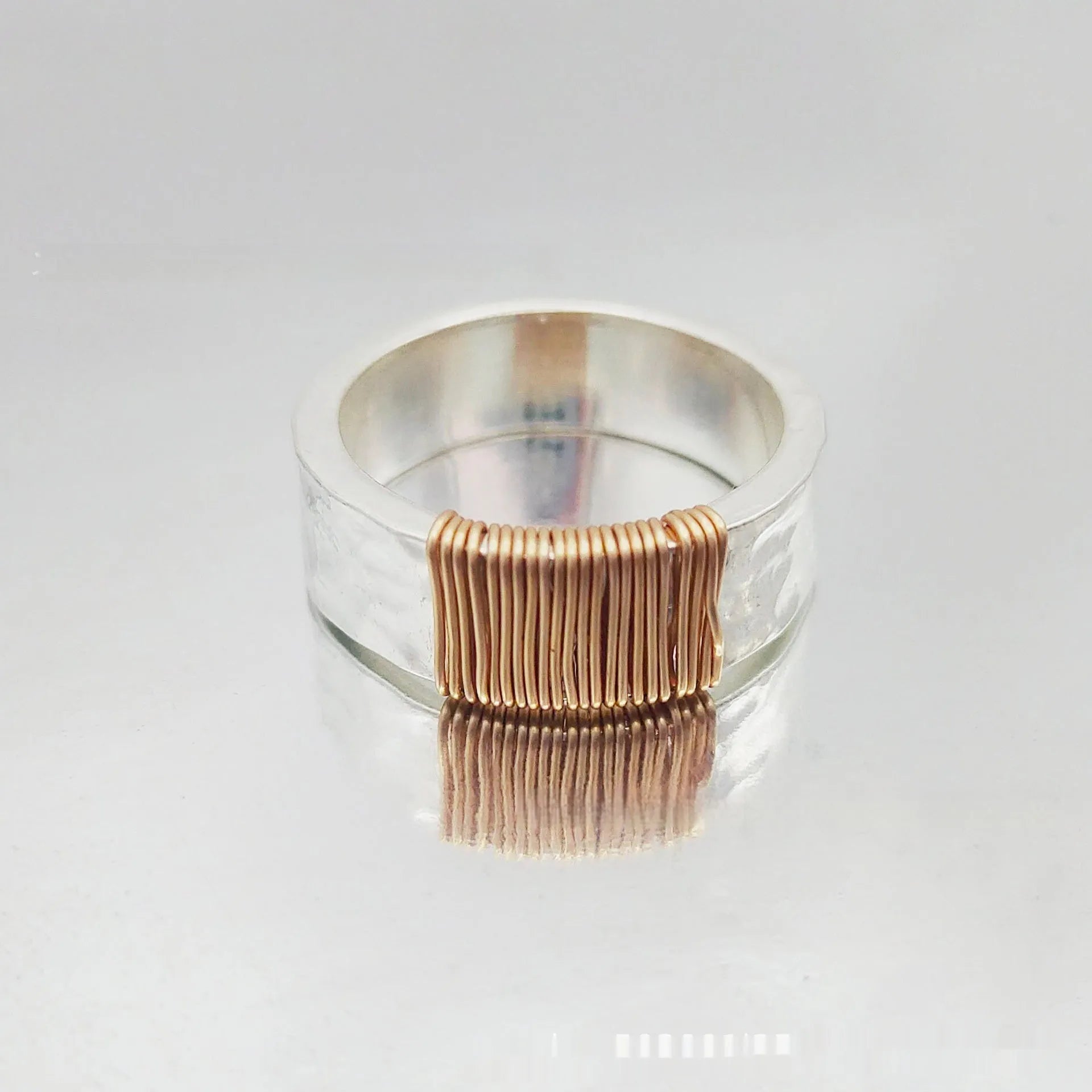Geometric copper ring bracelet with irregular coil design in silver gold finish