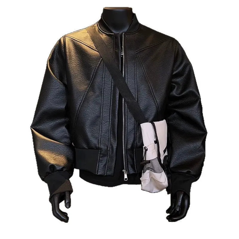 Man modelling a slim-fit black PU leather jacket with litchi grain texture and extended length.