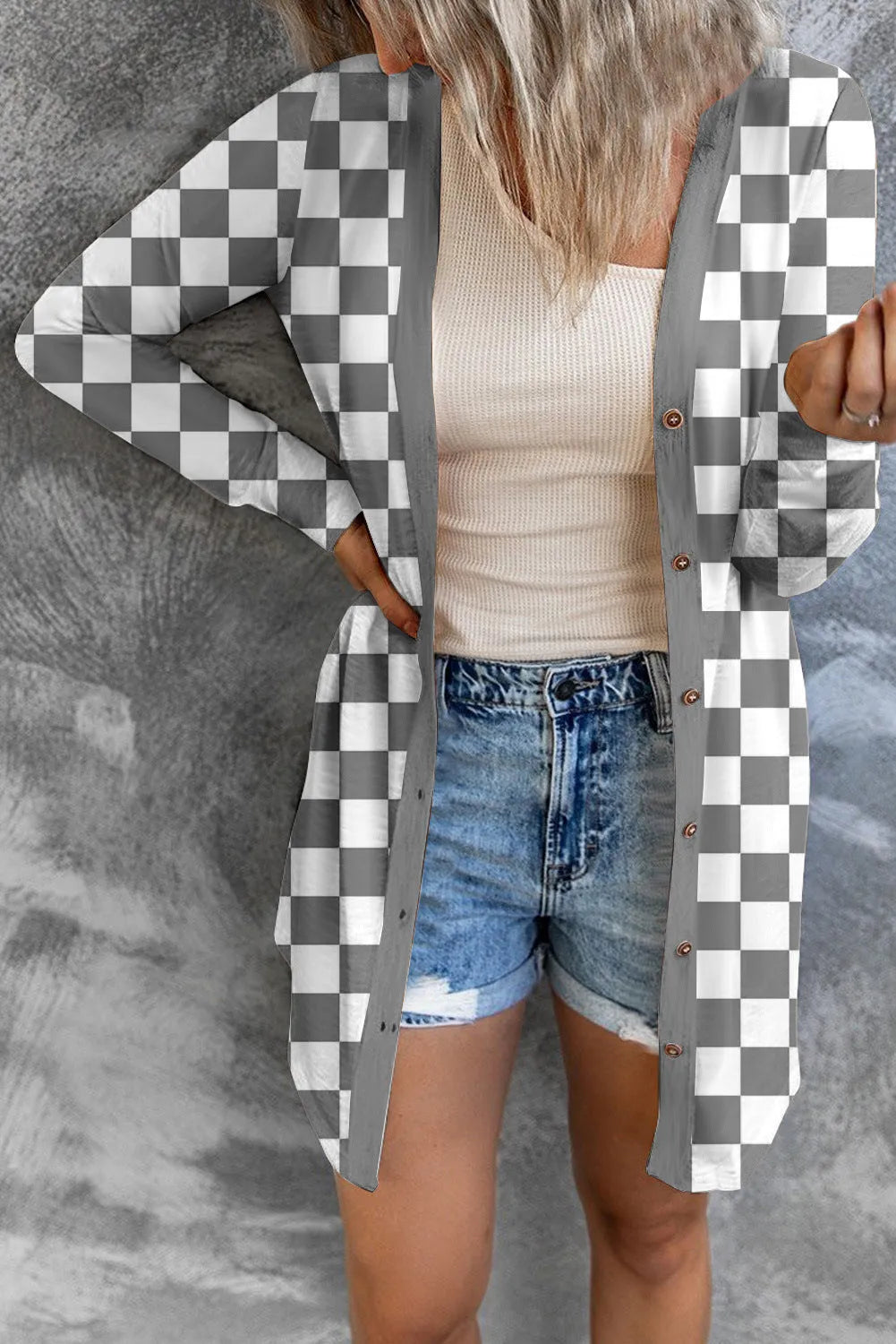 Women's long grey plaid pattern knitted cardigan coat with regular sleeves, shown on a model.