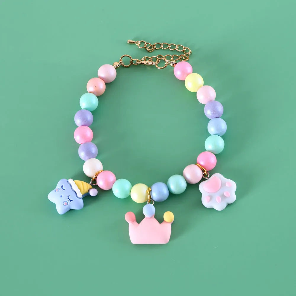 Pastel macaron charm pet collar with moon and rabbit designs on adjustable resin band for cats and dogs