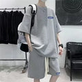 Waffle-textured cotton blend leisure sports suit set with short sleeve top and shorts.