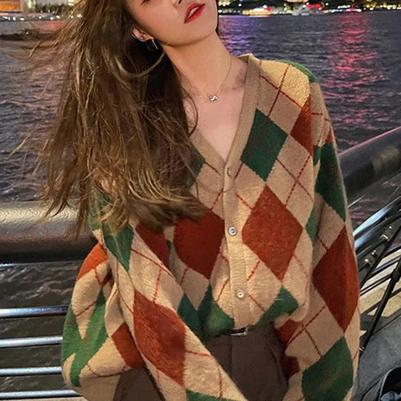 Casual pink knitted cardigan coat with regular sleeves, shown on a hanger.