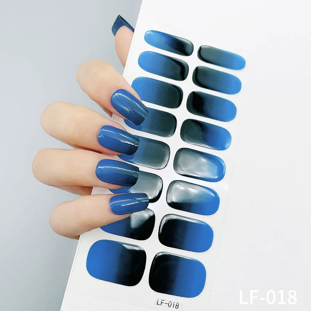 Set of 16 solid colour nail art stickers showing floral, geometric, and pattern designs for manicure application