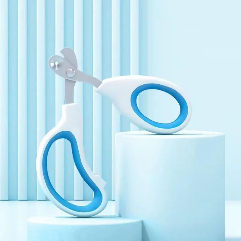 Blue cat nail clippers with circular hole and safety aperture for trimming pet nails