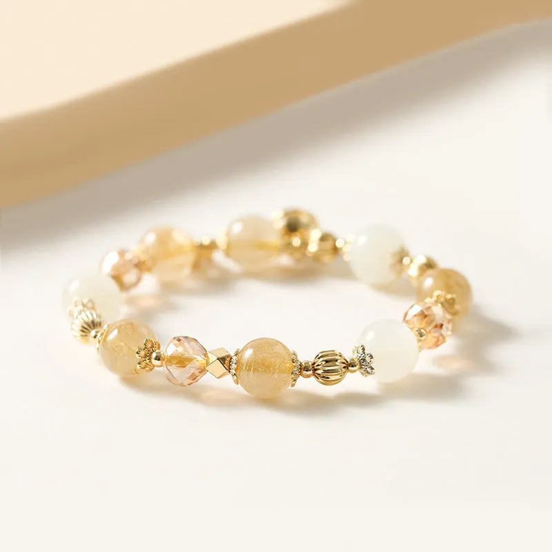 Gold electroplated rutilated quartz bracelet showing Korean style design and lucky fortune gold colour