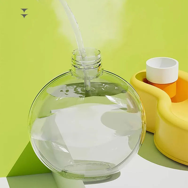 Green portable dog water bottle with integrated drinking bowl for outdoor travel and activities