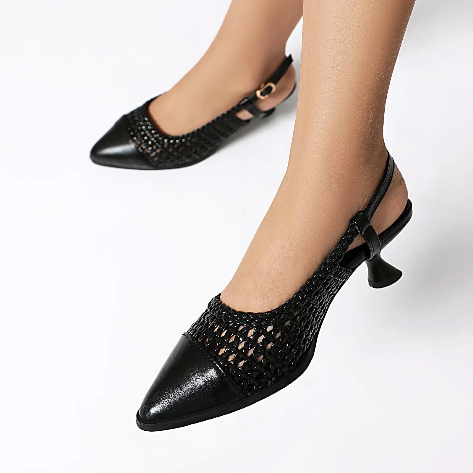 Black women's cat heel sandals with hollow-out design and buckle closure on a white background.