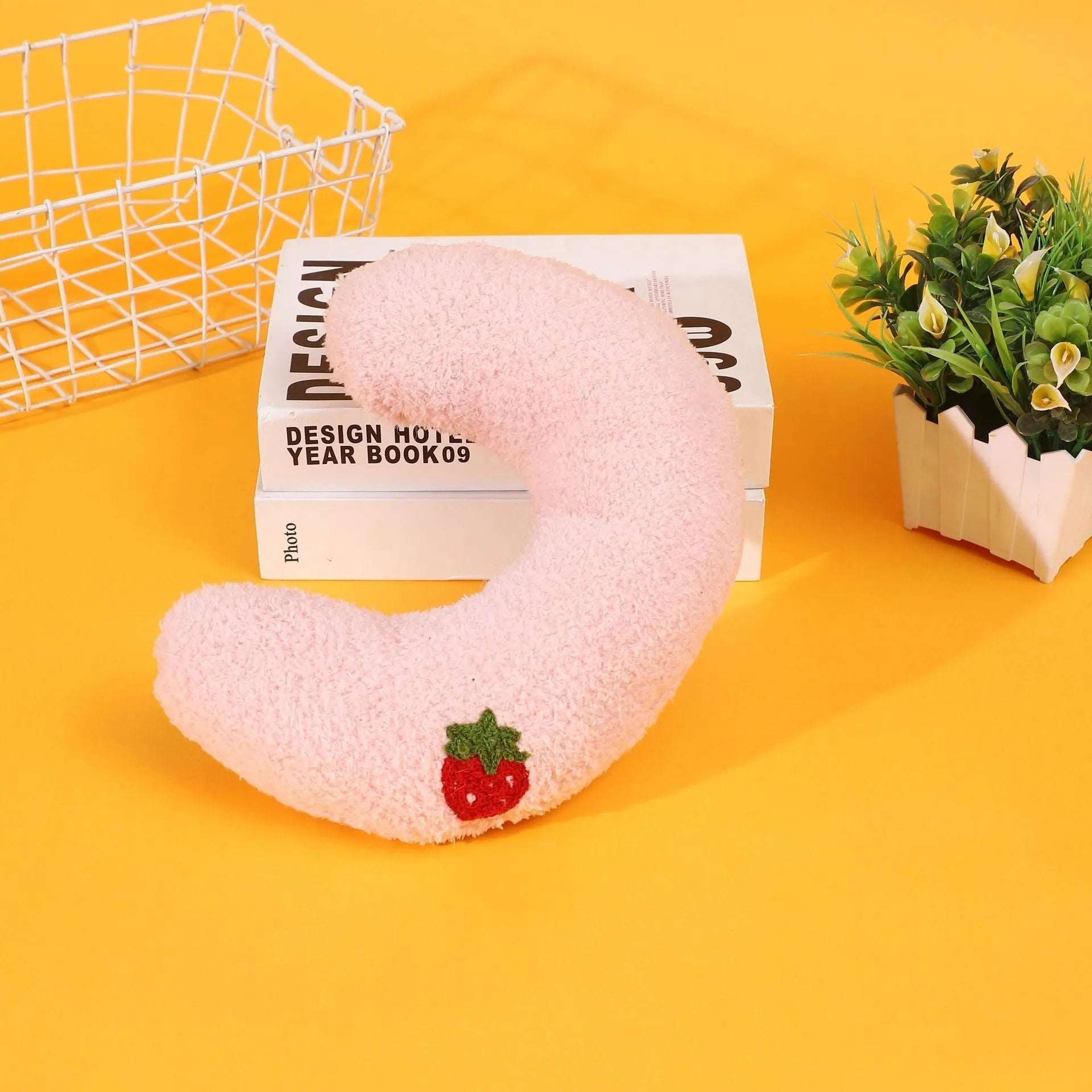 U-shaped half moon cloth pillow pet bed for cats in blue, pink, white, and yellow colours.