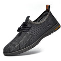 Men's black mesh casual shoes with elastic closure and round toe design