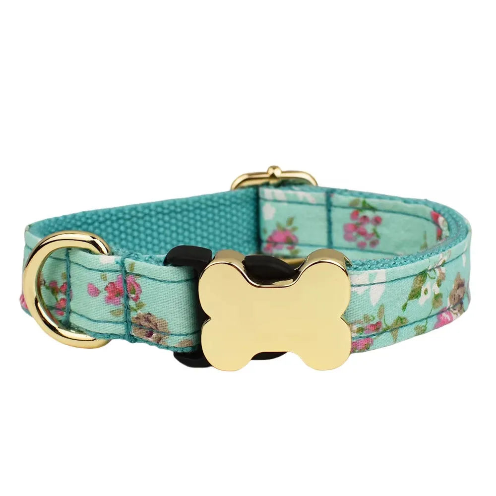 Flat nylon dog collar with grey grid print and a white bone-shaped plastic buckle.