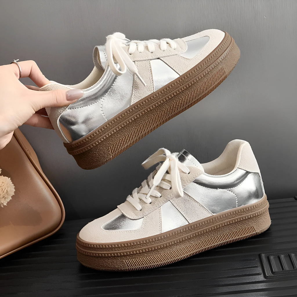 Retro sports shoes with round toe, cross straps, and lace-up front in milky white colour