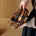 Women's black retro high heels with horse hair upper, square toe, stiletto heel, and an ankle strap buckle.