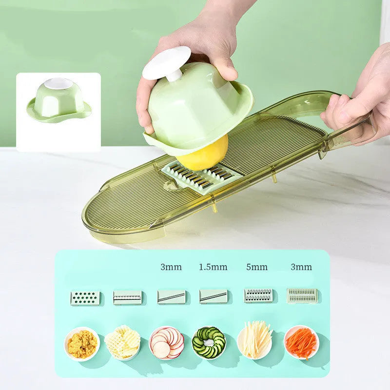 Transparent green vegetable cutter with stainless steel blades and 1.5L container
