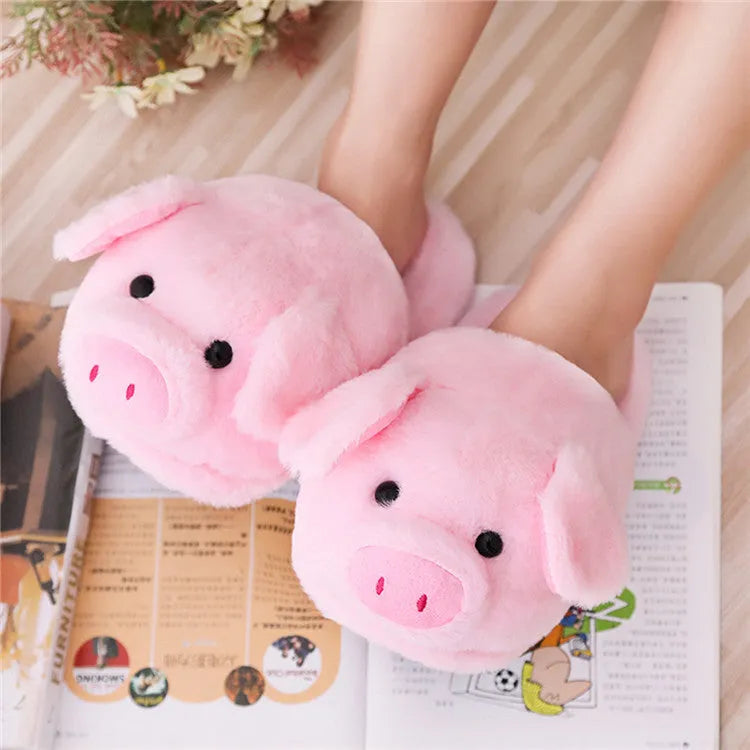 Pink plush pig slippers for adults with soft short fur and PP cotton filling on a white background.