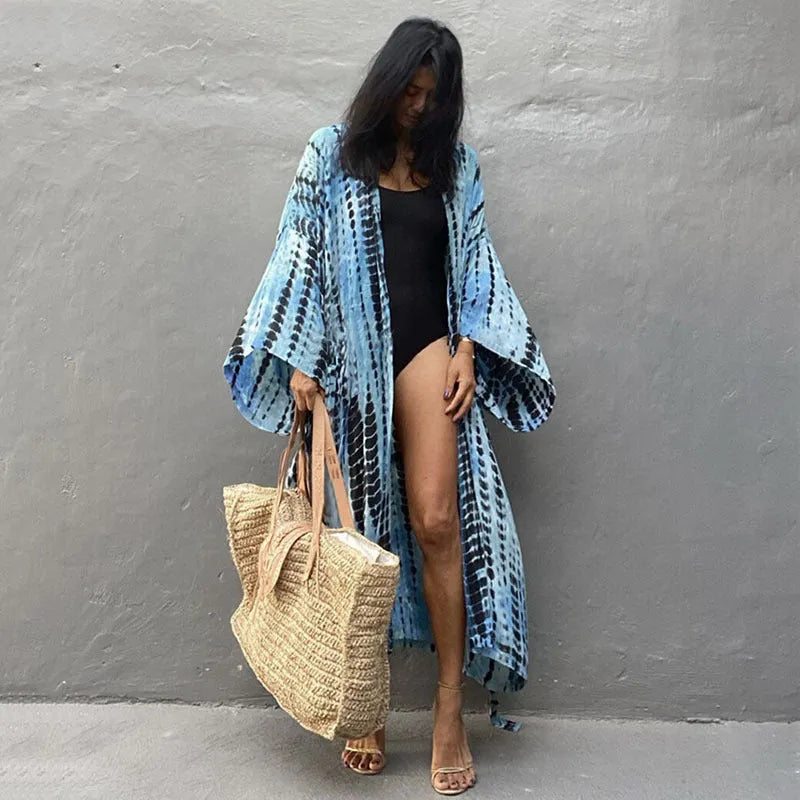 Loose cotton beach cover-up shirt in a printed design on a mannequin