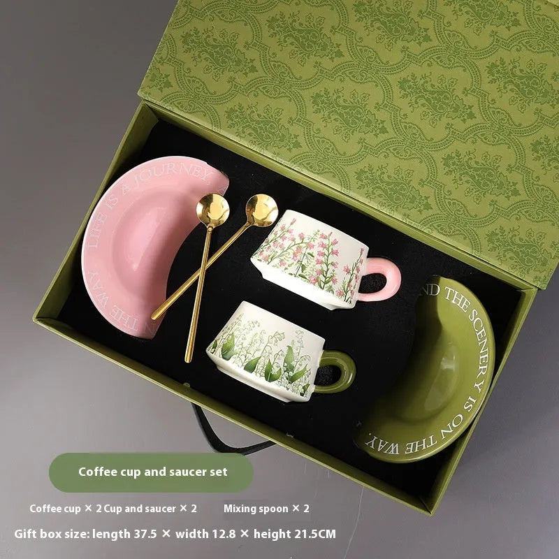 Ceramic coffee cup set with two 300ml cups, saucers and stirring spoons in decorative designs