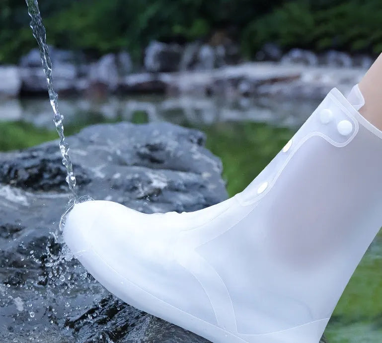 White high top PVC reusable waterproof shoe cover for women, shown on a foot.