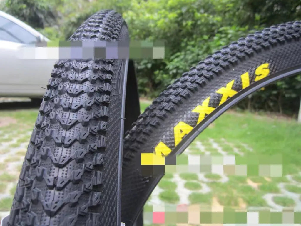 Ultralight mountain bike tyre with tread pattern shown, available in multiple sizes including 26, 27.5 and 29 inch diameters.