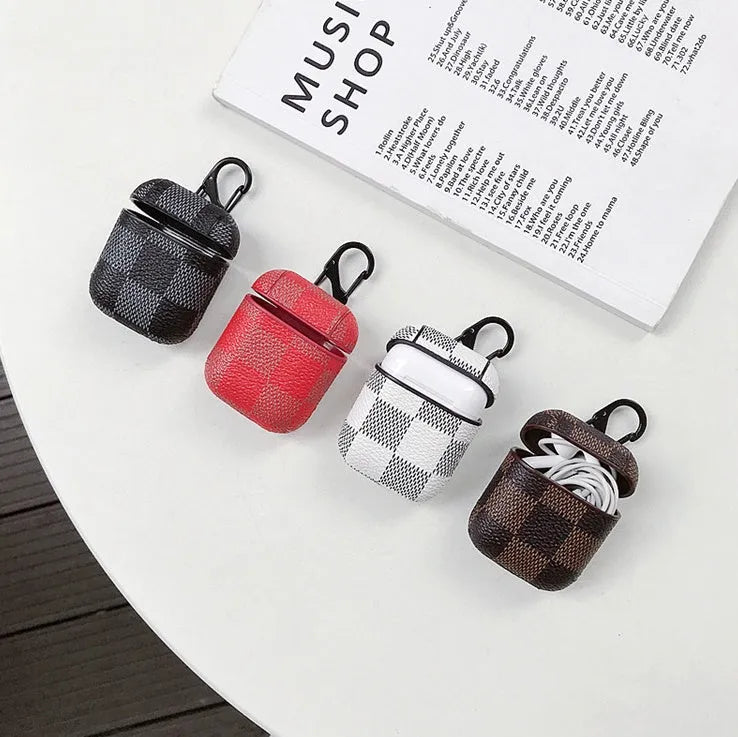 Hard plastic protective case for a wireless Bluetooth headset with an anti-lost hook, shown in a grid pattern.