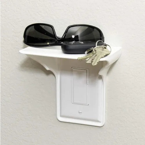 White plastic socket storage rack organiser with dimensions 14cm by 10cm by 15cm.