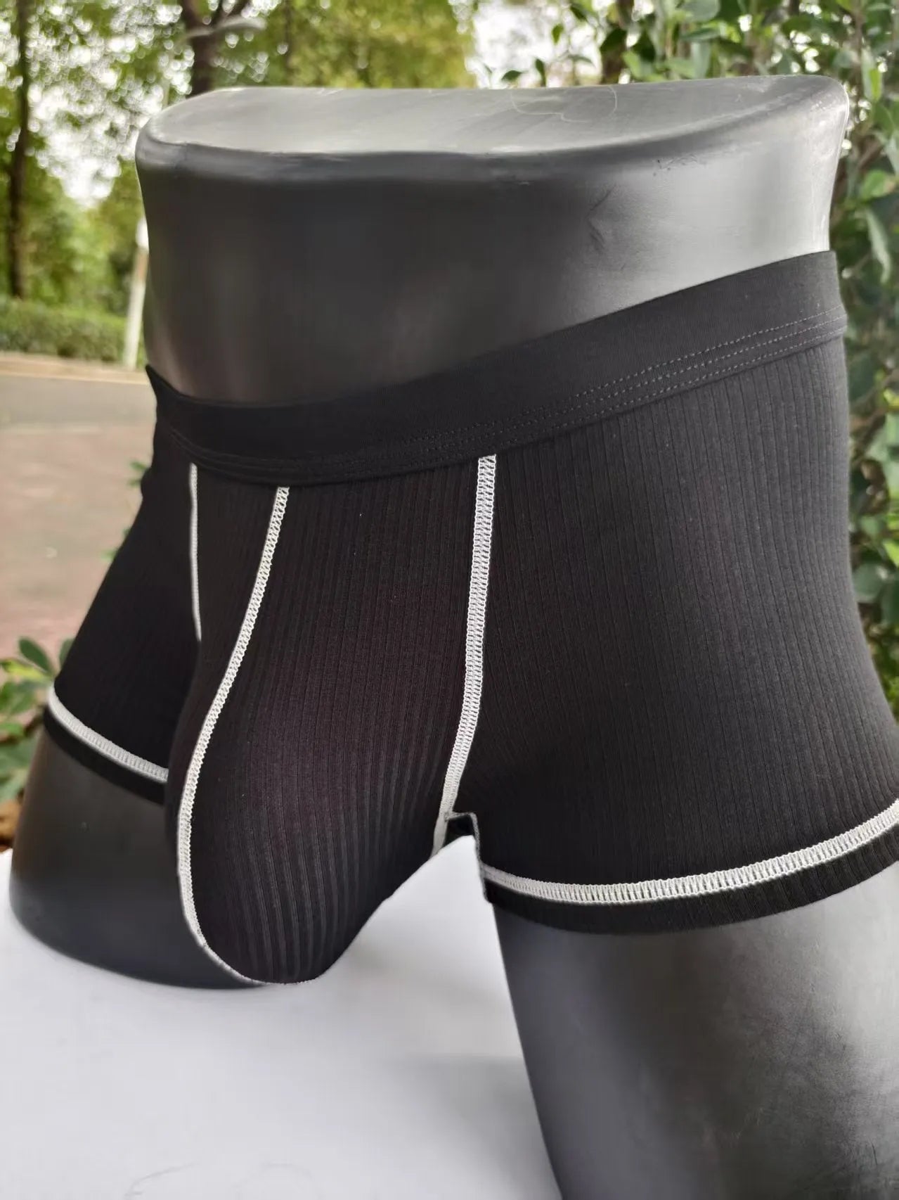 Solid colour men's boxer shorts in breathable fibre fabric, shown in Army Green.