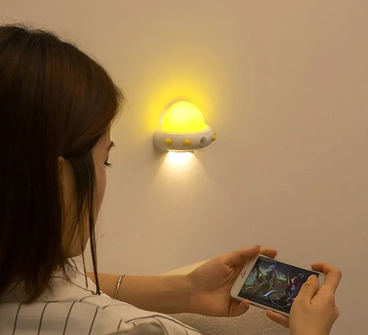 Blue remote control UFO shaped bedside night light with dimensions 105mm by 76mm by 58mm