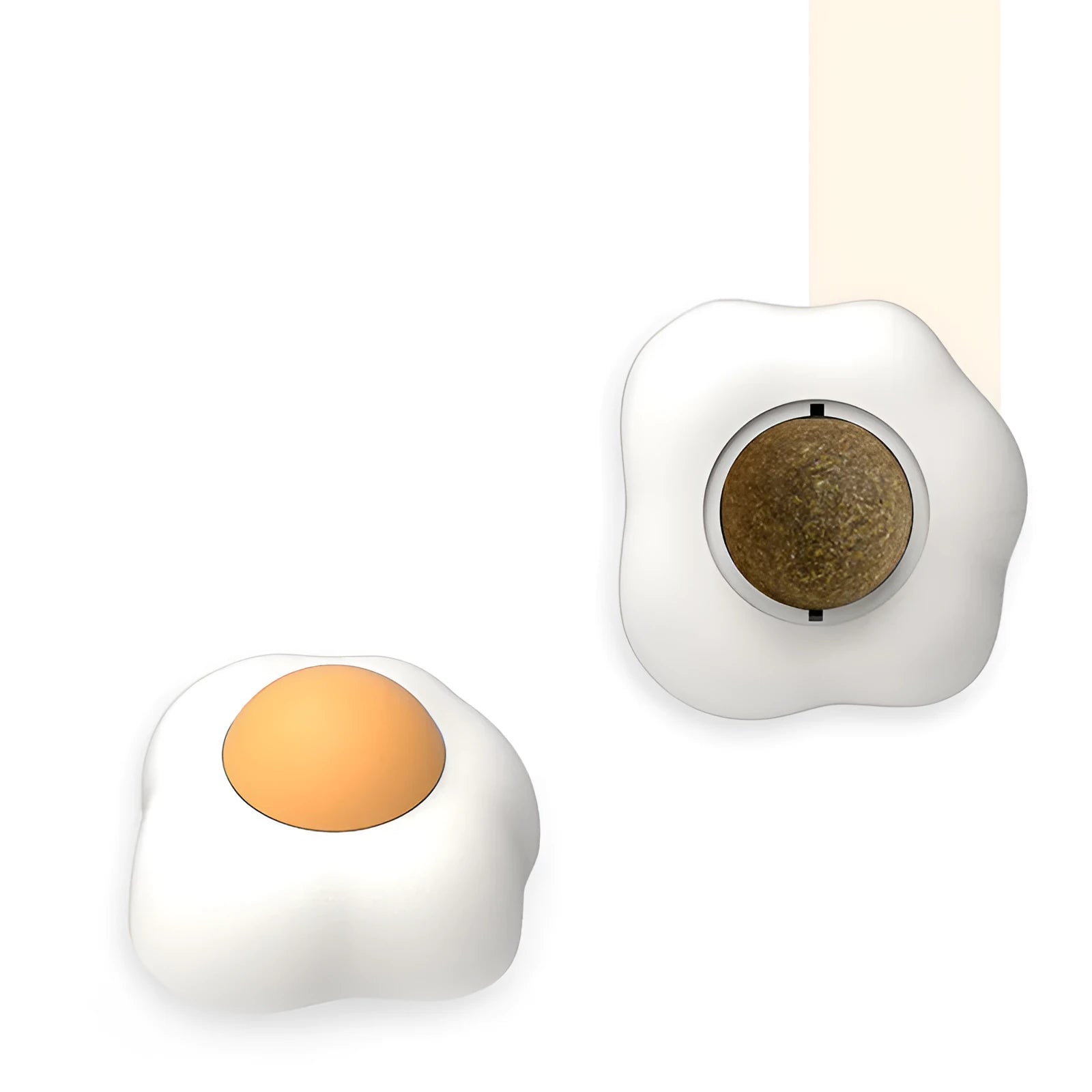 Catnip ball toy in fried egg and poached egg shapes with adhesive backing for wall mounting