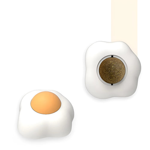 Catnip ball toy in fried egg and poached egg shapes with adhesive backing for wall mounting