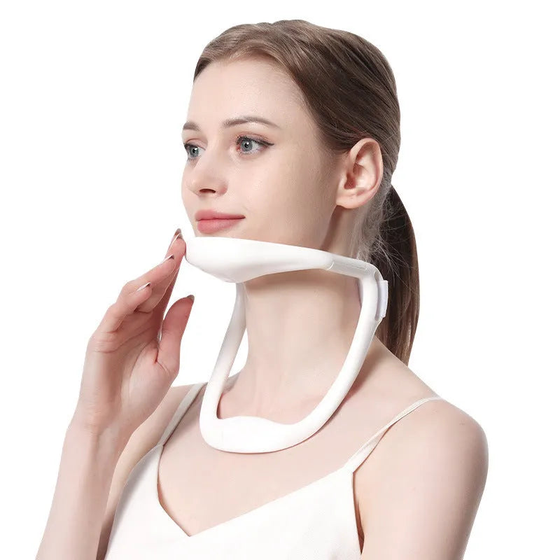 White PP plastic neck brace for cervical spine support on a neutral background.