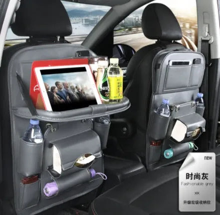 PU leather car storage hanging bag with multiple pockets and built-in trash can mounted on car seat