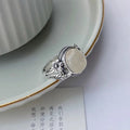 Adjustable copper vintage ring with white chalcedony stone and U-shaped band