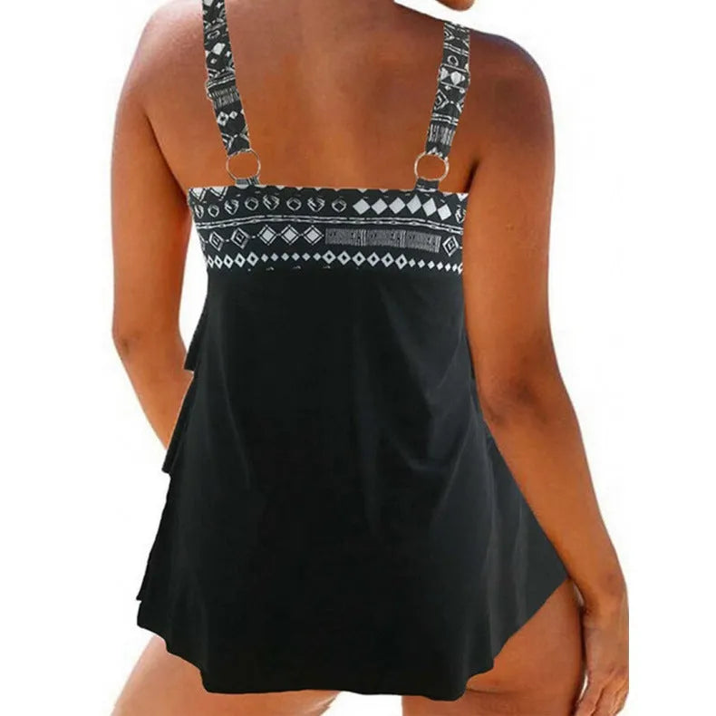 Plus-size women's one-piece swimsuit with double shoulder straps and a decorative bow.