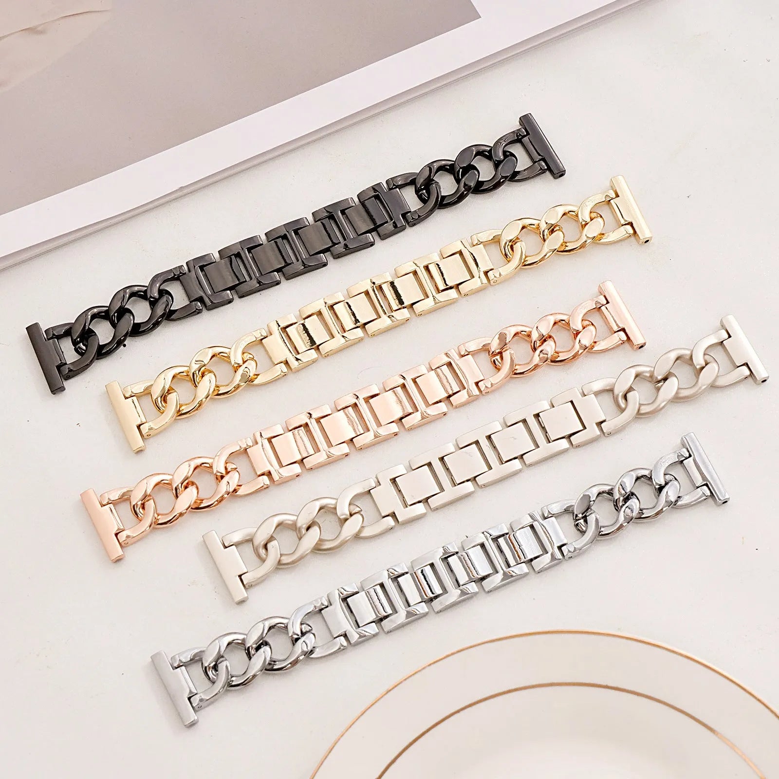 Metal denim chain replacement strap for Apple Watch in silver, black, gold, rose gold, and Starlight colours.